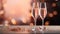 Bokeh lights background with pink rose champagne glasses for elegant festive celebration