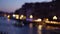 Bokeh night shot of the Grand canal with boats traveling on the water