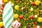 Bokeh photo, Decorative of Chistmas tree with fake red and white lollipop candy, golden yellow and, red bolls on green leaves