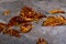 Bokeh of select focus of broken amber vase shards on floor