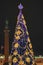 Bokeh silhouette of Christmas tree.