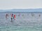 Bol, Croatia, July 25, 2021: Windsurfers surfing on the sea at Zlatni Rat beach. Symbol of the Adriatic Sea on the island of Brac