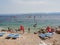 Bol, Croatia, July 25, 2021: Windsurfers surfing on the sea at Zlatni Rat beach. Symbol of the Adriatic Sea on the island of Brac