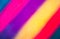Bold coloured blurred stripes of different bright colors.