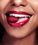 Bold lips speak volumes about your confidence. an unrecognizable woman posing with a cherry in her mouth.