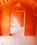 Bold orange doorway, never ending India