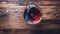 Bold Textures: Aerial View Of Red Wine Glass On Wooden Table
