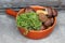 Boletes and moss in terracotta pan