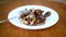 Boletus mushrooms fried with onions in a plate