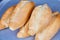 Bolillos five loaves Mexican baked good soft bread on slate blue-gray tray background