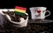 Bolivian flag in a bag with coffee beans isolated on black