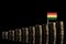 Bolivian flag with lot of coins isolated on black