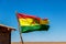 Bolivian Flag waving in the wind against blue sky background