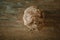 Boll of clay lying on wooden table prepared for pottery wheel