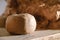 Boll of clay lying on wooden table prepared for pottery wheel