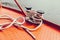 Bollard and mooring rope on red metallic surface of boat