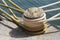 Bollard with ropes near water
