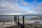 Bollards in the Wadden Sea with floating ice at Oostoever, Den Helder, The Netherlands