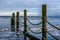 Bollards in the Wadden Sea with floating ice at Oostoever, Den Helder, The Netherlands