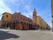 Bologna ITALY - 9 August 2023 - Facade of Santa Maria della Mascarella church with brick arcades and bell tower