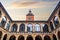 Bologna, Italy Biblioteca Comunale dell\\\'Archiginnasio courtyard with clock tower against sky