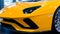 Bologna, Italy - December 9, 2019: Original yellow Lamborghini Aventador. Logo and front grill, headlights. Luxury stylish sport c
