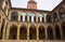 Bologna, Italy famous for the porticoes streets with collonades. Inner yard of the palace in the ancient city and clock tower