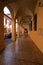 BOLOGNA, ITALY - MAY 03, 2016: Yellow walls of Portico, sheltered walkway in the streets of Bologna, Emilia-Romagna, Italy