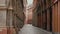 BOLOGNA, ITALY - MAY 20, 2019: Typical old narrow street with famous arcades