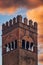 Bologna, Italy13th-century Palazzo Podesta tower against dramatic orange clouds