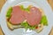 Bologna sandwich with lettuce, bread, mayonnaise and ketchup