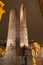 Bologna - The towers Torre della Garisenda and Torre della Asinelli and square Piazza della Mercanzia at night