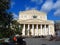 Bolshoy Theater in Moscow. People rest on benches on Theater Square.