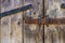 Bolted old vintage retro rustic wooden door. Background with copy space