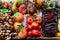 Bolzano, Italy - wood baskets full of colorful and abundant autumn season organic fruits like orange pumpkin, red ripe pomegranade