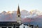 Bolzano, South Tyrol, Italy - view of a bell tower and Dolomites mountains