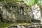 Bomarzo, Italy - September 08, 2017 - Ancient bas-relief Three Graces at the famous Parco dei Mostri, also called Sacro Bosco or G