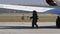 Bomb Disposal Expert with Anti Explosions Suite Transport a Bomb from a Airplane
