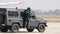 Bomb Disposal Experts with Anti Explosions Suite on a Military Off Road Vehicle