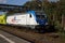 A Bombardier Class 187 locomotive is waiting with a freight train for departure at Marburg station.