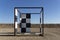 Bombay Beach, California, USA - August 6, 2021: Half of checkered frame art in a abandoned desert in Salton city