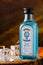 Bombay sapphire gin bottle on black and orange background