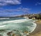 Bondi Beach in Sydney NSW Australia on a sunny winters day partly cloudy skies Pacific Ocean waves and nice sandy beach