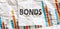 BONDS word text on the white memo note crupled sticker on chart background