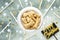 Bone biscuits in white bowl on festive green background happy birthday lettering