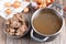 Bone Broth Bouillon in Metal saucepan on the table, paleo diet