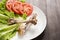 Bone chicken and vegetable on wooden background.