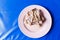 Bone fragments of chickens select focus,Chicken bone is placed on a pink plate soft focus,Bone