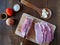 Boneless, slightly frozen pork meat is being sliced on a kitchen board