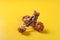 Bones of deep fried chicken drumstick and wing on yellow background